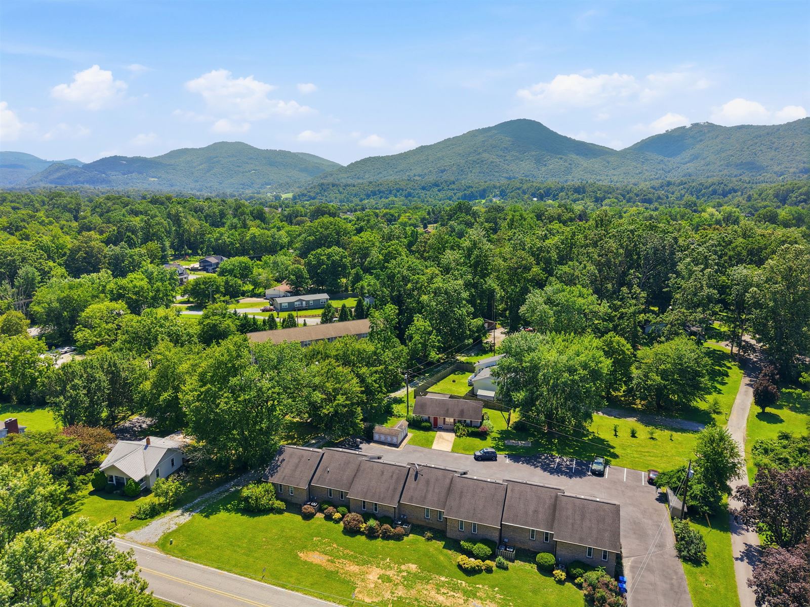 The community from above with mountains beyond