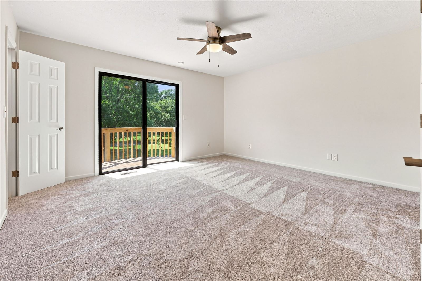 Primary bedroom with sliding door to the balcony