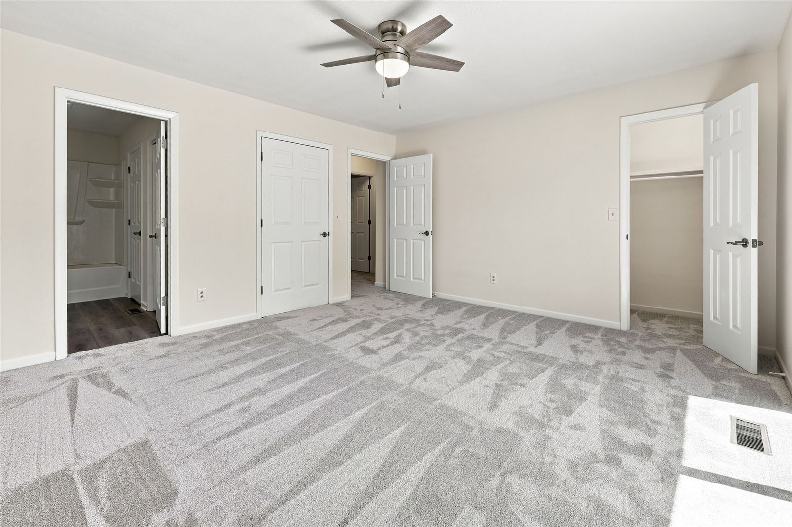 Primary bedroom with closet and bath access
