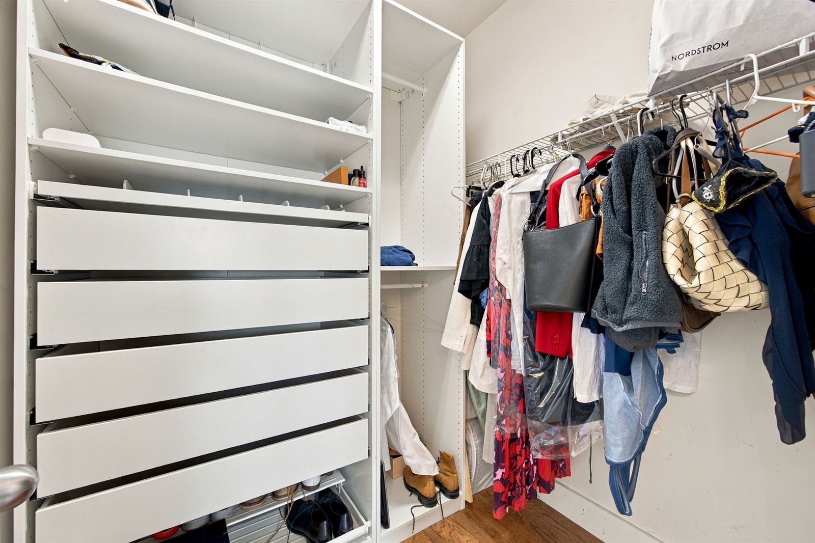 Walk-in closet with custom drawers and shelving