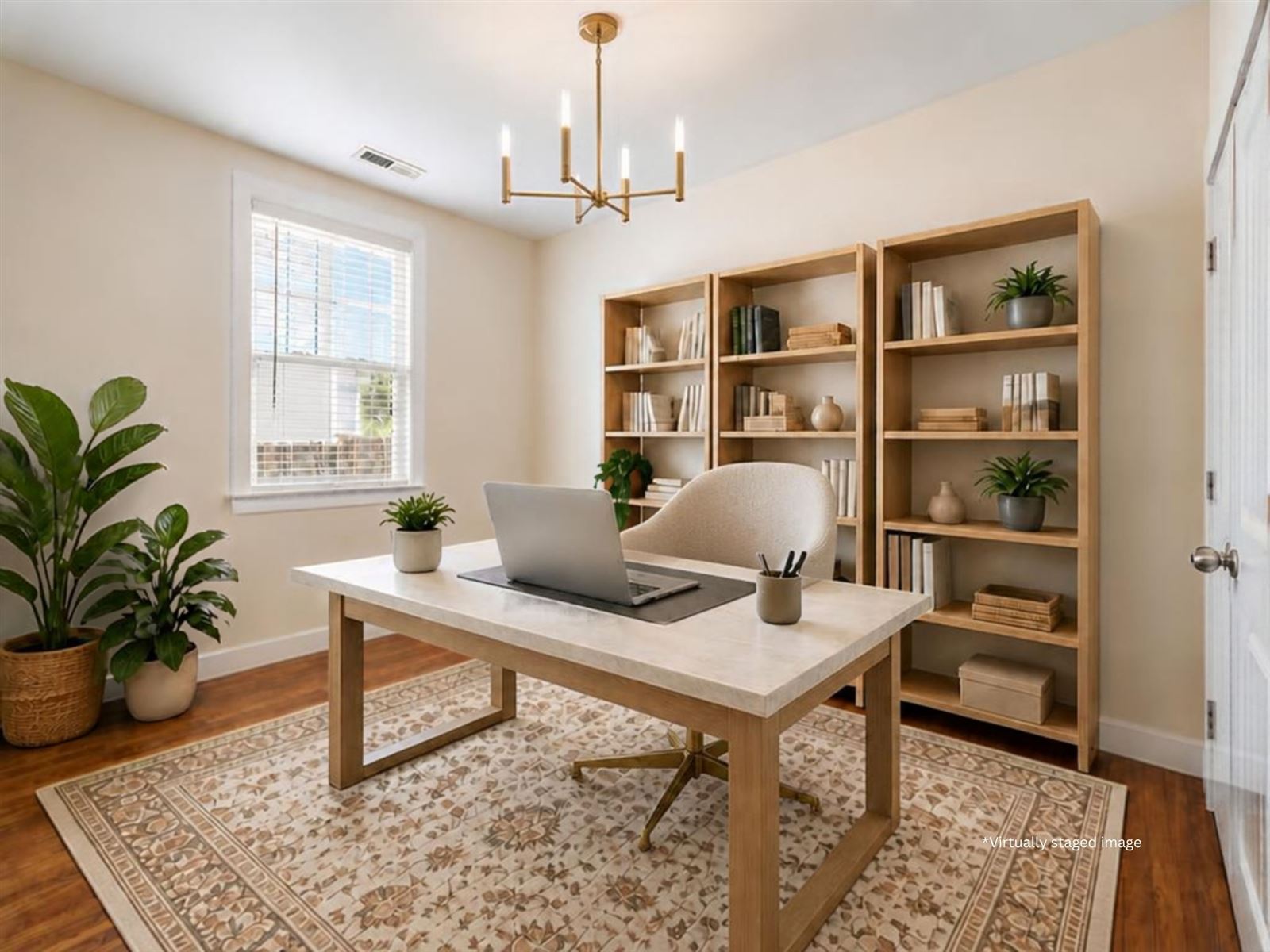 The same bedroom, virtually staged as a home office