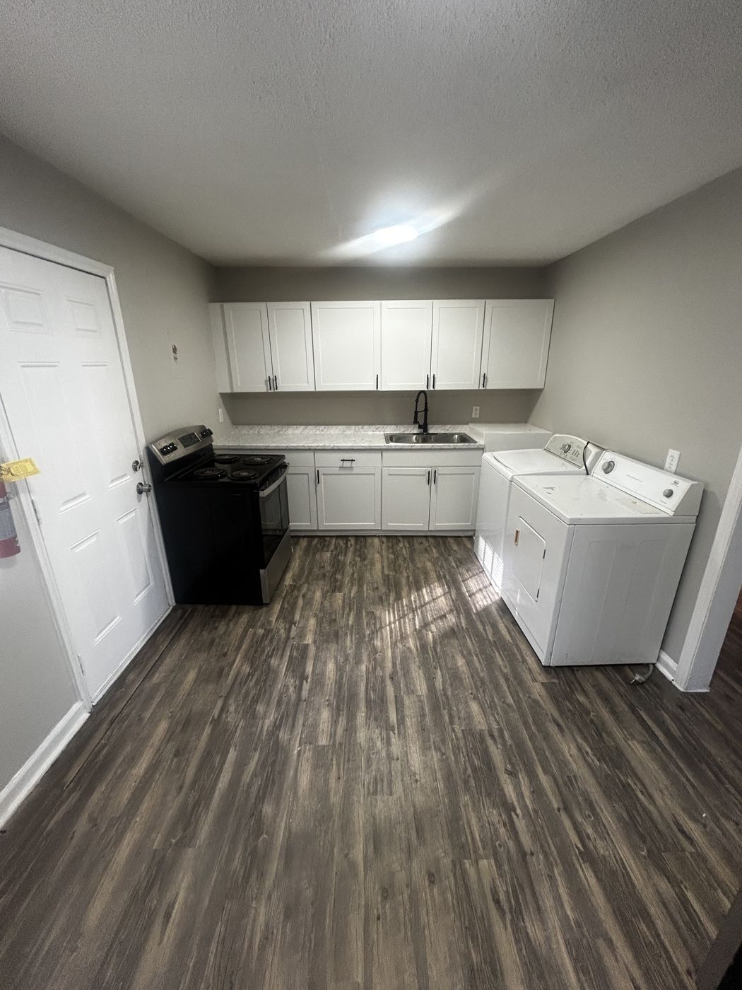 Kitchen with washer and dryer