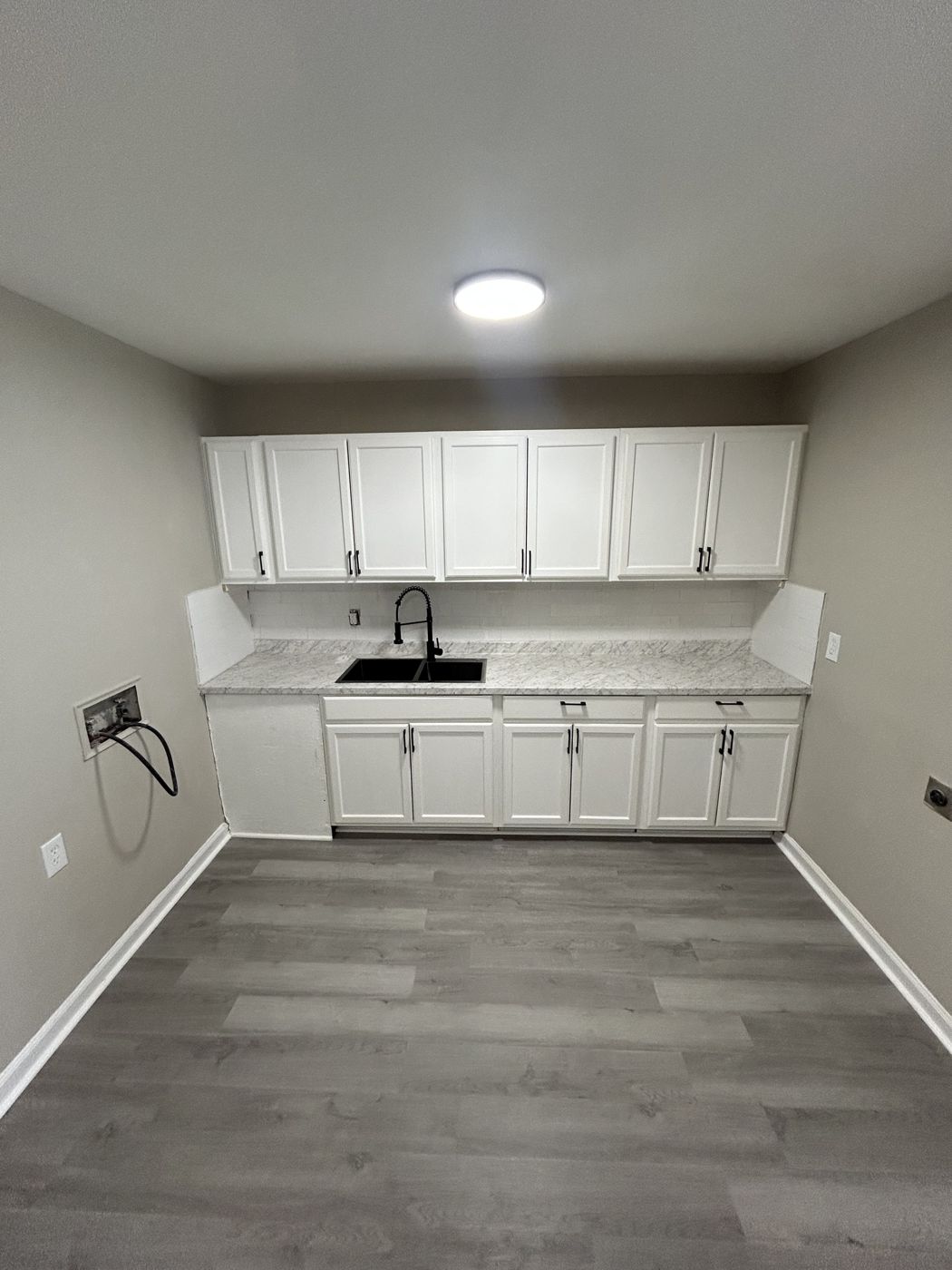 Kitchen with white cabinetry
